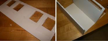 Two photos: (left) A rectangle of white foam core board representing the front fa&ccedil;ade of a house, with packing tape covering both sides of two cut-out openings. (right) Two side walls are attached vertically to two edges of a rectangular foam core base.