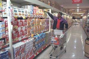 photo of shopper in cereal aisle of grocery store