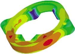 A colorful CAD drawing shows a circular part with color variations from red to orange to yellow to green to blue.