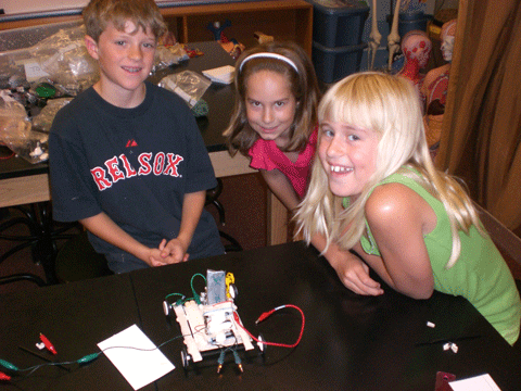 Photo shows three students with their completed toy.