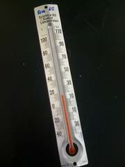 An analog thermometer.