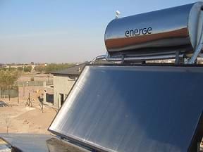 A solar thermal thermosyphon water heater placed on a rooftop.