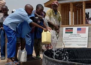 Children get clean drinking water from the Shant Abak Well built by the Naval Mobile Construction Battalion (NMCB) in Africa.