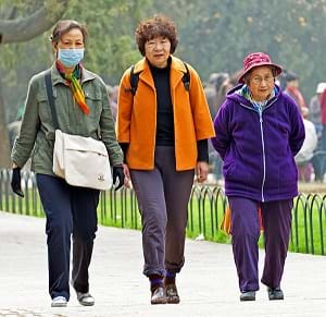 A woman wearing an air pollution mask in Beijing, China.