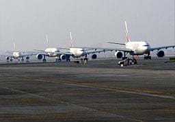 A photo shows several airplanes taxiing on the runway at Dubai International Airport in Dubai, United Arab Emirates.