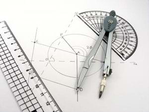 A photograph shows geometry tools: a compass, protractor, calipers and set square. The tools lay on a drawing with lines, circles and angles that was created with the tools.