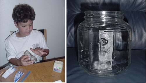 Two photographs. In one, a child spreads petroleum jelly on the outside of a small glass jar. The second photograph shows the small glass jar placed inside a large glass jar.
