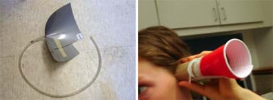 Two photos of ear trumpets, one made from flexible gray plastic material cut and folded like a cone and taped to keep its shape with a length of 0.7 cm clear rubber tubing attached to the point of the cone (left), and another made from a sliced plastic picnic cup taped to a cardboard paper towel tube, held up to a student's ear (right).