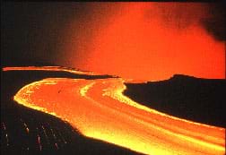 A photograph shows a flow of hot orange lava.