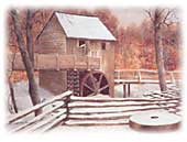 A photograph shows a rough wood building with large wooden water wheel partially immersed in a snow-covered river.