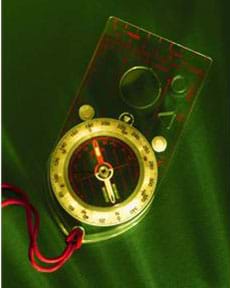 A photograph of a compass on a lanyard.