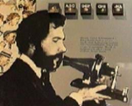A drawing shows a man with a mustache and beard speaking into an early telephone.