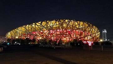 The Beijing National Stadium (Bird's Nest) at night where the 2008 Olympics were held.