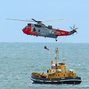 A boat and helicopter at sea.