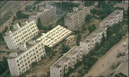 Multistory buildings rest at various tilted angles because of soil liquefaction following the 1964 Niigata earthquake in Japan.