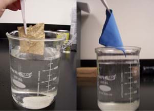 Two photos show items just removed from being submerged underwater in beakers: (left) a brown material, and (right) a swatch of blue cloth; both look dry.