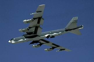 A photograph shows an airplane in flight, a B-52 Stratofortress, which is a long-range, heavy bomber airplane that can perform a variety of missions.