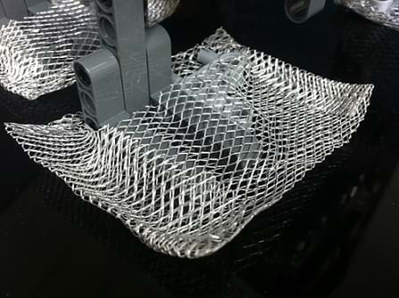 Photo shows the robot foot with square extensions made of metal mesh material.