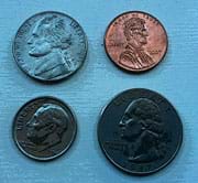 Photo shows the heads sides of four U.S. coins: nickel, penny, dime and quarter.