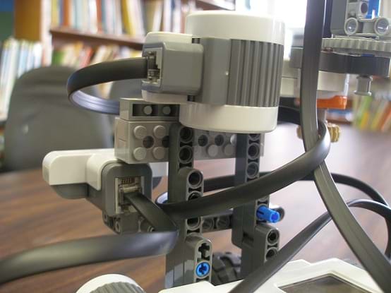 Photo shows how the front-facing and side-sensor are attached to the robot