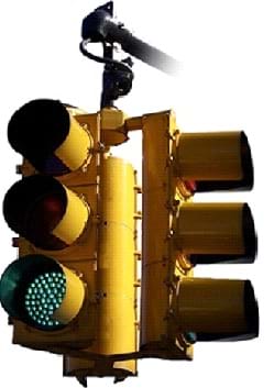Photo shows a 3-way traffic light, each prong with three lights—one for red, yellow and green.