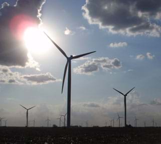Landscape photo shows a wind turbine farm in Indiana.