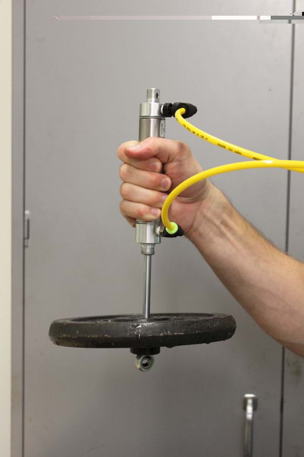Photo shows a 10-lb weight being pulled up by cylinder pressurized at 30 psi.