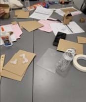 A photo of a student desk covered with prototyping materials. 