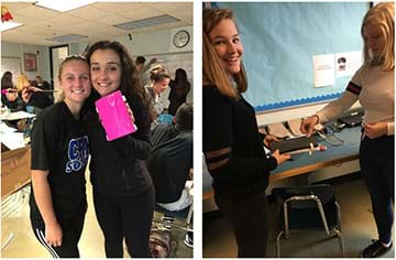 Left: two female students stand and display their pink shin guard prototype. Right: two female students stand at a counter attaching elastic straps to their shin guard prototype. 