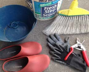 Photograph shows plastic gardening shoes, bowl, bucket, broom, clipper handles, gloves and rubber bands.