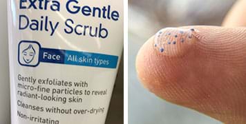 Two photographs. A close-up of the label for a tube of “extra gentle daily scrub” for face and all skin types. Further, it says: Gently exfoliates with micro-fine particles to reveal radiant-looking skin. A close-up photograph shows the tip of a finger with a blob of clear gel containing a scattering of tiny round blue particles—plastic microbeads.