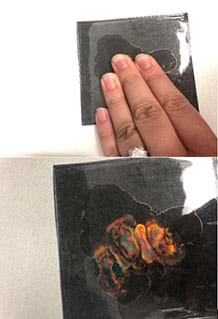 Top image shows a woman’s fingers pressing on a black liquid crystal thermometer. Bottom image shows colors showing up on the black liquid crystal thermometer where the fingers pressed.