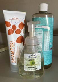 A photograph shows three cleaning products, one shampoo and two liquid soaps.