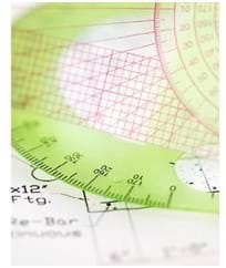 A photo shows a protractor on graph paper with equations and notes written on the paper.