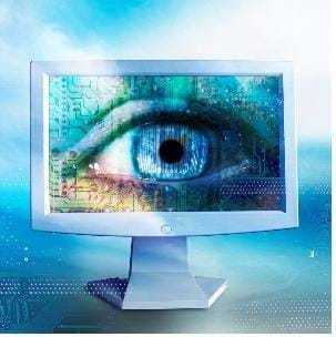 A computer screen with a human eye pictured on it.