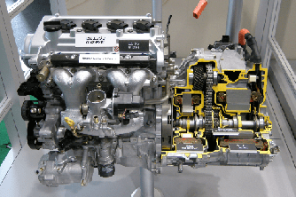 A Toyota engine showing a cutaway view of a Hybrid Synergy Drive (HSD) motor and generator.
