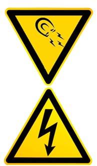 Two triangular images of magnetic and electric field warning signs. They are both bright yellow bordered in black lines, one with an image of a u-shaped magnet and the other with a jagged arrow, inside each.