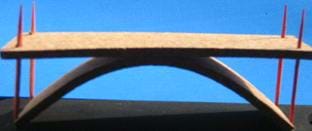 Same as the Figure 4 photo, with the addition of an arched piece under the road surface.