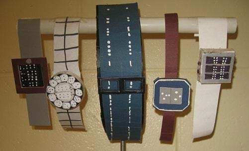 A photograph shows five different-looking student designed wristwatches, all with raised dots on the watch faces or bands.