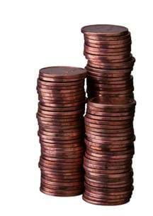 Photo shows three stacks of copper pennies.