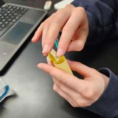 A photo showing how the flap on the bottom of the primary antibody should be taped inside (or outside) the cylinder to secure the base. The base circle will provide a place to attach the Velcro dot.