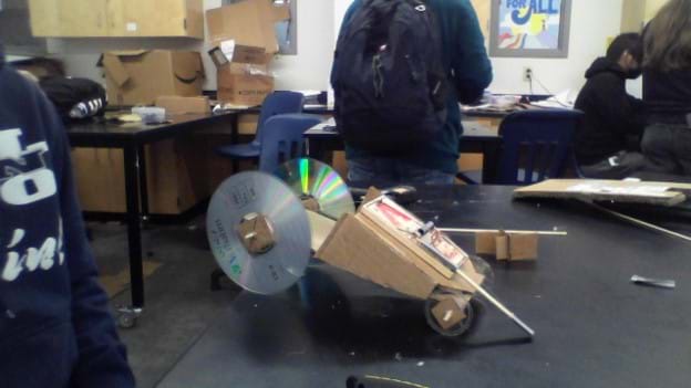 Student-designed examples of the Mouse Trap Car Design Challenge activity.
