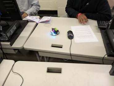 A photo showing students sitting at a desk with the code for LED display on the ELECFREAKS Cutebot. A photo showing students sitting at a desk with the code for LED display on the ELECFREAKS Cutebot.