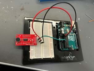 A photo of a sound detection circuit built on a breadboard, featuring a red sound detector module connected to an Arduino Uno board, demonstrating basic electronics for noise level measurement. A photo of a sound detection circuit built on a breadboard, featuring a red sound detector module connected to an Arduino Uno board, demonstrating basic electronics for noise level measurement.