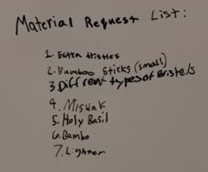 A handwritten list of materials brainstormed.