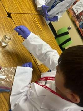 A photo showing a student preparing the counter electrode.